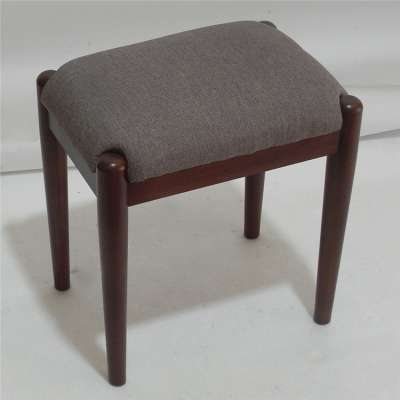 Bar dark brown four legged chair without backrest and sponge cushion